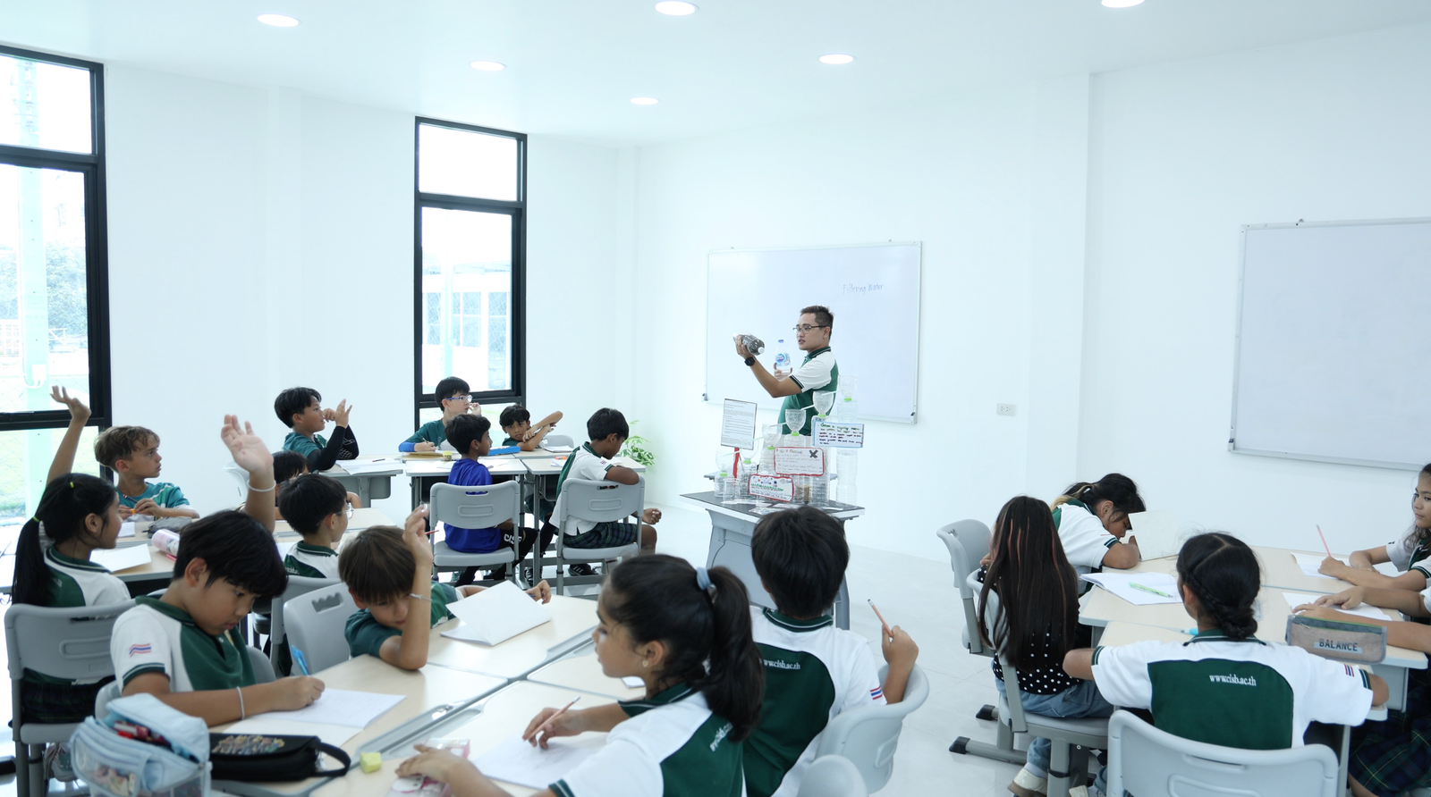 CISB students engaged in a hands-on classroom lesson